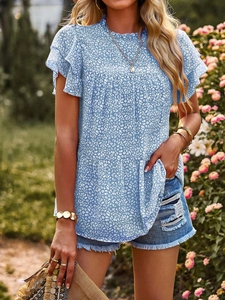 Detail of layered ruffle short sleeves and elastic stand collar on light blue floral blouse