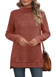 Detail view of the side slit and ribbed texture on the terracotta turtleneck knit top