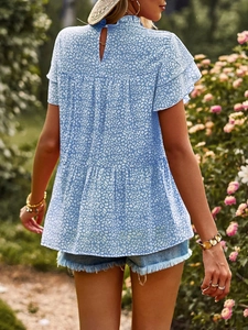 Back view of light blue floral chiffon blouse with tiered ruffle sleeves and keyhole detail