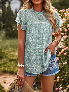 Detail view of mint green polka dot chiffon blouse with double-layer ruffle sleeves