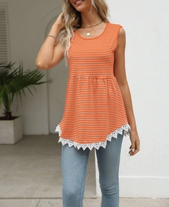 Detail of orange striped tank top featuring asymmetrical white lace trim on the hemline