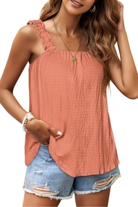 Detail of smocked apricot tank top featuring ruffled wide straps and pleated texture
