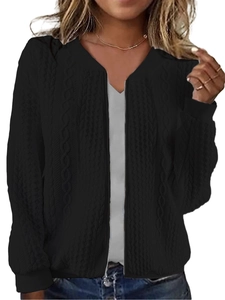 Detail of black cable knit pattern and silver zipper on this women's sweater jacket