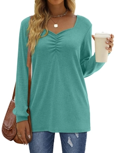 Detail of the V-neckline with ruched chest design on this teal long sleeve top