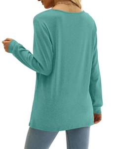 Detail of teal long sleeve top showing the soft knit texture and precise side stitching