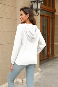 Detail view of white waffle knit hoodie for women showing textured fabric and hooded back