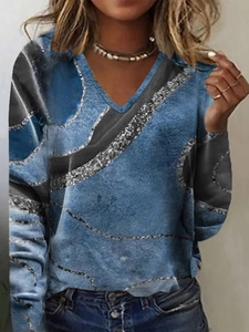 Women's blue V-neck long sleeve top with abstract silver glitter marble print