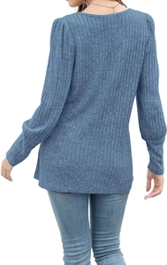 Rear view detail of light blue ribbed knit long sleeve shirt with soft fabric texture