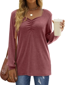Detail of ruched V-neckline and soft knit texture on women's long sleeve tunic top