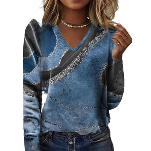 Detail view of women's slim V-neck long sleeve top with dark blue abstract textured print