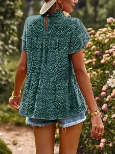 Detail of dark green leopard print top featuring ruffled sleeves and back keyhole closure