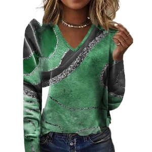 Detail of V-neckline on women's long sleeve top with green and black artistic print