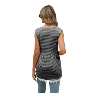 Detail view of women striped tank top with delicate white floral lace trim at the hem