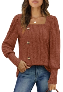 Detailed view of rust red square neck knit top with wood buttons and ribbed cuffs