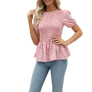 Detail of pink floral short sleeve top with smocking texture and puff sleeves