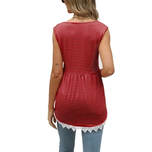 Detail view of red striped sleeveless top featuring delicate white lace trim hem at the back