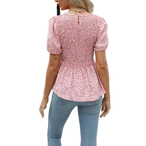Detailed back view of pink floral blouse featuring smocked elastic texture and puff sleeves