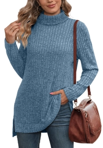 Detail view of the gray-blue high-neck knit sweater featuring side slit and ribbed texture
