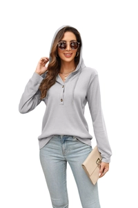 Light gray waffle knit drawstring hoodie for women featuring wood-style buttons