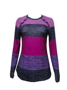 Detail of color block striped long sleeve top with decorative buttons on shoulder