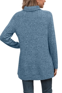 Detailed side view of blue ribbed turtleneck sweater showing knit texture and high collar