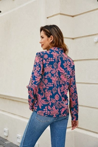 Detailed side view of dark blue floral shirt with pink flower print and stand collar