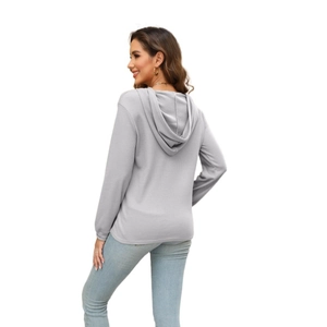 Detailed back view of light gray waffle texture hoodie with ribbed cuffs for women