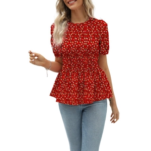 Detailed view of the red floral smocking waist and elastic texture on a puff sleeve blouse