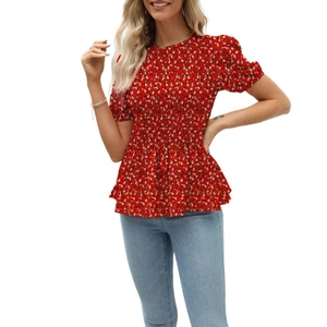 Detail of red floral short sleeve blouse with elastic smocked waist and ruffle hem