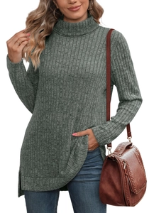 Detailed close-up of the ribbed knit texture and side split hem of this grey-green sweater