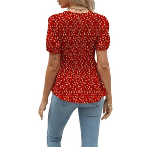 Detail of red floral smocked top back with keyhole closure and elastic texture