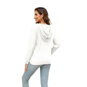 Rear view of a white waffle knit hooded long sleeve top for women with curved hemline