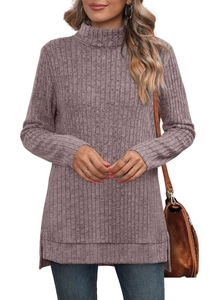 Detail of mauve knit top showing side slit hem and textured ribbed fabric finish