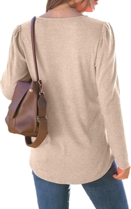Detail view of oatmeal long sleeve top featuring bubble sleeves and a curved hemline