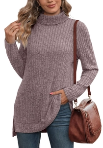 Detail view of ribbed texture and side slit hem on a mauve high neck long sleeve top