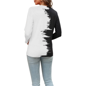 Detail of the unique asymmetrical sawtooth cut and black and white contrast on the back of the T-shirt