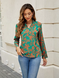 Elegant V-neck long sleeve floral print blouse with green and orange botanical patterns