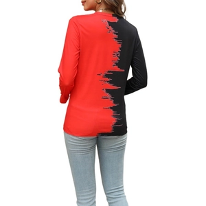 Detail view of red and black color-block top with jagged rip texture on the back
