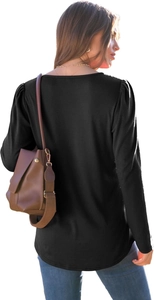 Detail view showing the sleek back tailoring and puff sleeve design of this black long sleeve top