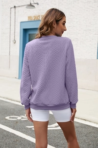 Close-up of the cable knit texture on the back of this casual light purple zip-up hoodie
