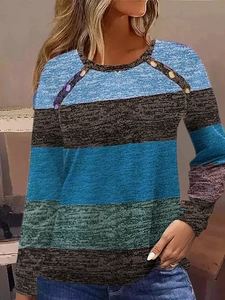 Detail of retro buttons and color-block striped fabric on long sleeve women's t-shirt
