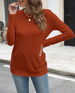 Detail of caramel ribbed knit long sleeve shirt with a slim fit and crew neck design