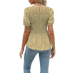 Detail of yellow floral short sleeve blouse with smocked waist and peplum hem back view