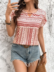 Close-up of bohemian red geometric print top with V-neck cutout and ethnic patterns
