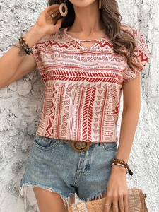 Detail of bohemian red and white geometric patterns on women's casual short sleeve shirt
