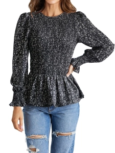 Black floral long sleeve peplum top with smocked detailing and white flower print