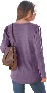 Detail view of purple puff sleeve top with knit texture and round neck design