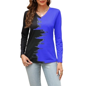 Detail of V-neck long-sleeve top featuring black and blue contrast patchwork pattern
