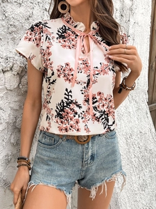Women floral short sleeve blouse with pink bow tie neck and white floral pattern