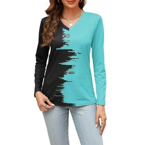Detail of V-neck stitching on a long-sleeved shirt with artistic black and green print